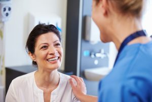 Female,Patient,Being,Reassured,By,Doctor,In,Hospital,Room